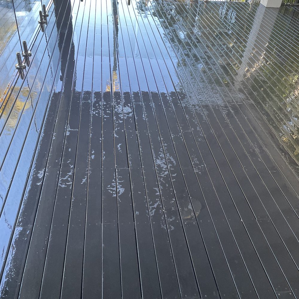 Dark deck half way through a soft wash