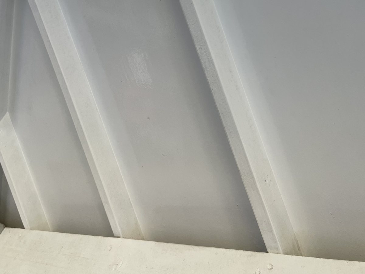 The same roof lining after soft washing — clean white beams